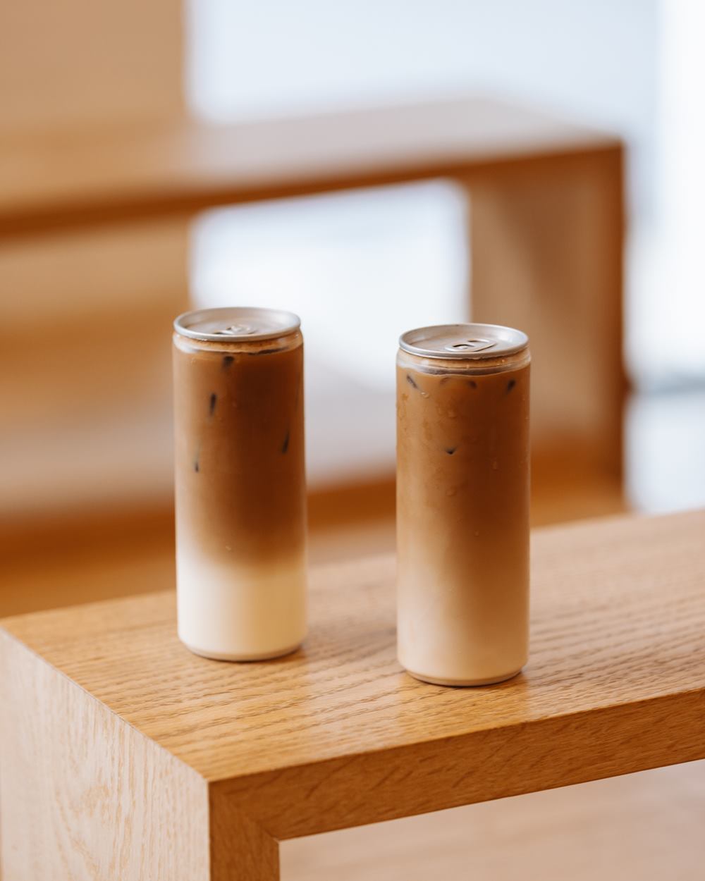 Iced lattes in sealed clear cans